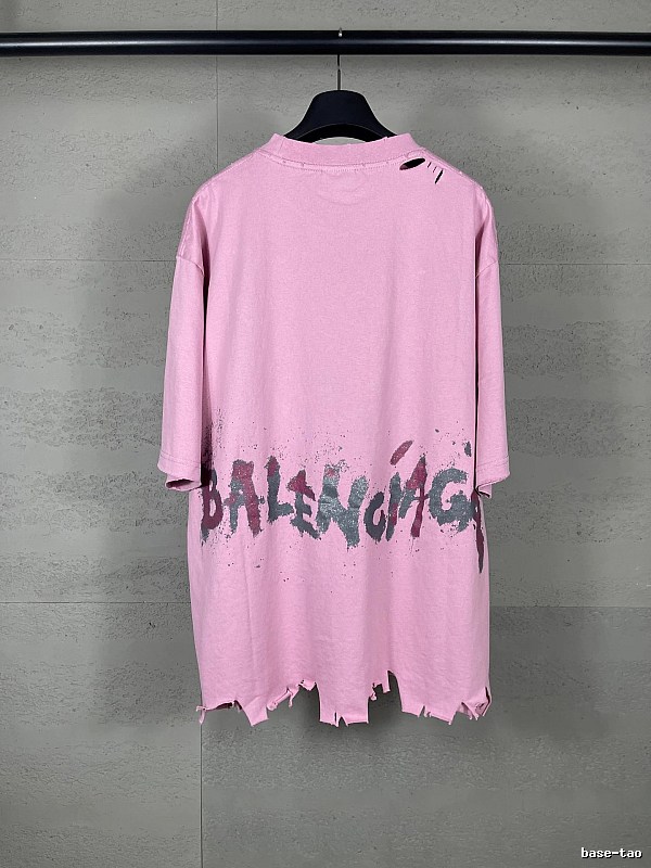 Balenciaga's pink T-shirt with a hole and graffiti style