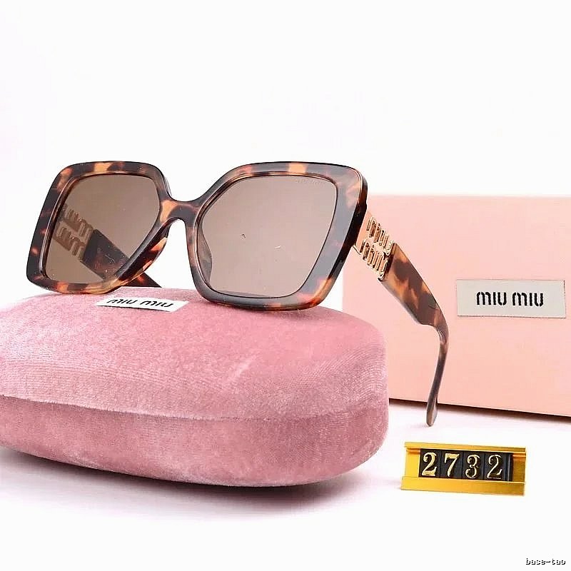 Miu Miu Patterned Oversized sunglasses Black Oval Sunglasses with Polished Detail