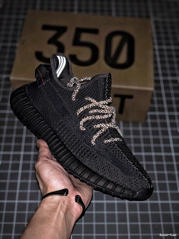 Yeezy Black Knit Sneakers Defined by Sock-Like Collar